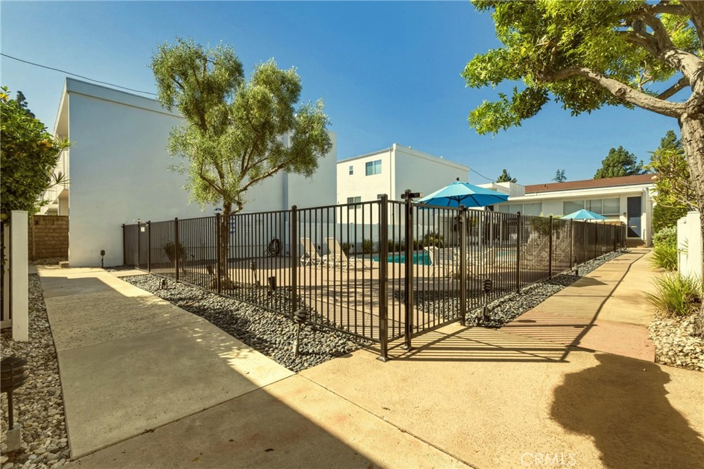 4331 West Sarah Street, Unit 10 Burbank, CA 91505 - Photo 26 of 26 a view of a house with a iron fence