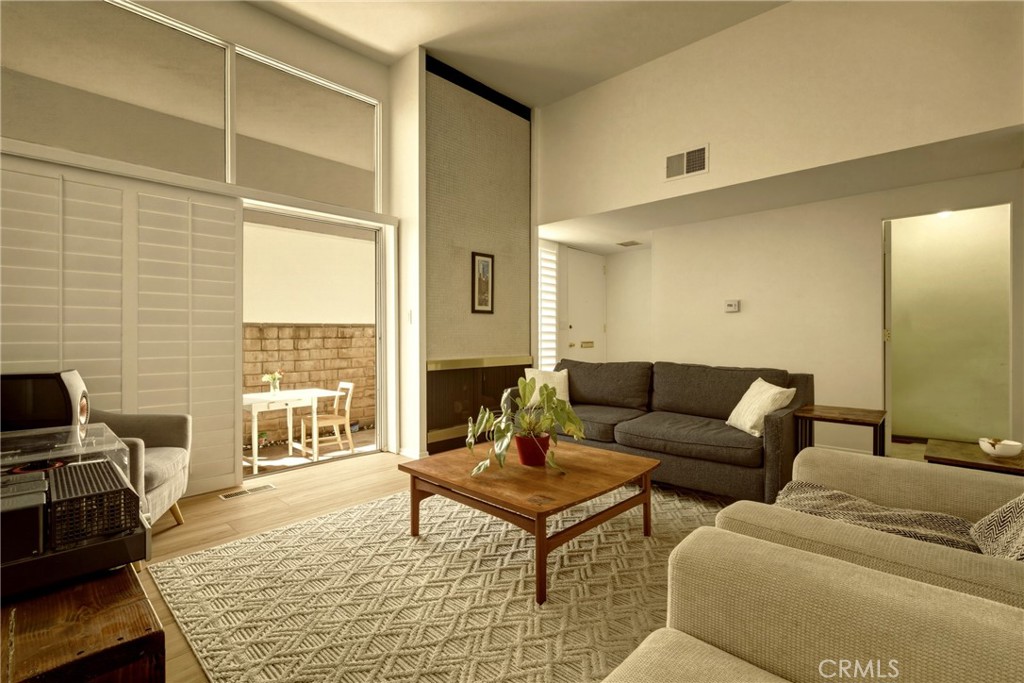 4331 West Sarah Street, Unit 10 Burbank, CA 91505 - Photo 4 of 26 a living room with furniture and a table