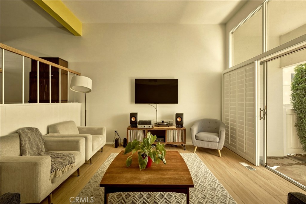 4331 West Sarah Street, Unit 10 Burbank, CA 91505 - Photo 7 of 26 a living room with furniture and a flat screen tv
