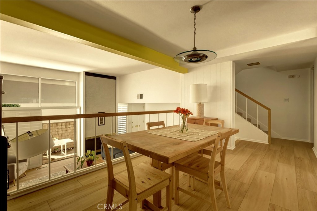 4331 West Sarah Street, Unit 10 Burbank, CA 91505 - Photo 9 of 26 a view of a dining room with furniture and wooden floor