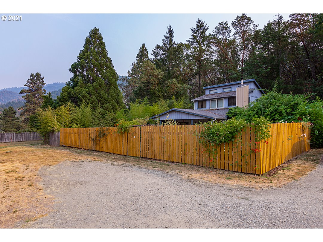 1856 Canyonville-Riddle Road Riddle, OR 97469 - Photo 2 of 27 a view of a backyard with trees