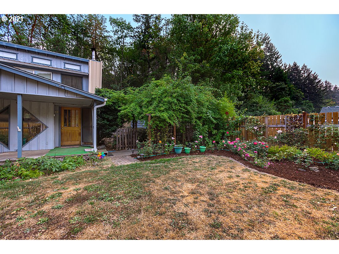 1856 Canyonville-Riddle Road Riddle, OR 97469 - Photo 4 of 27 a view of a house with backyard and garden