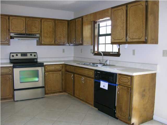 104 Beacon''s Bend Road Crestview, FL 32536 - Photo 6 of 26 a kitchen with stainless steel appliances granite countertop a sink stove and refrigerator
