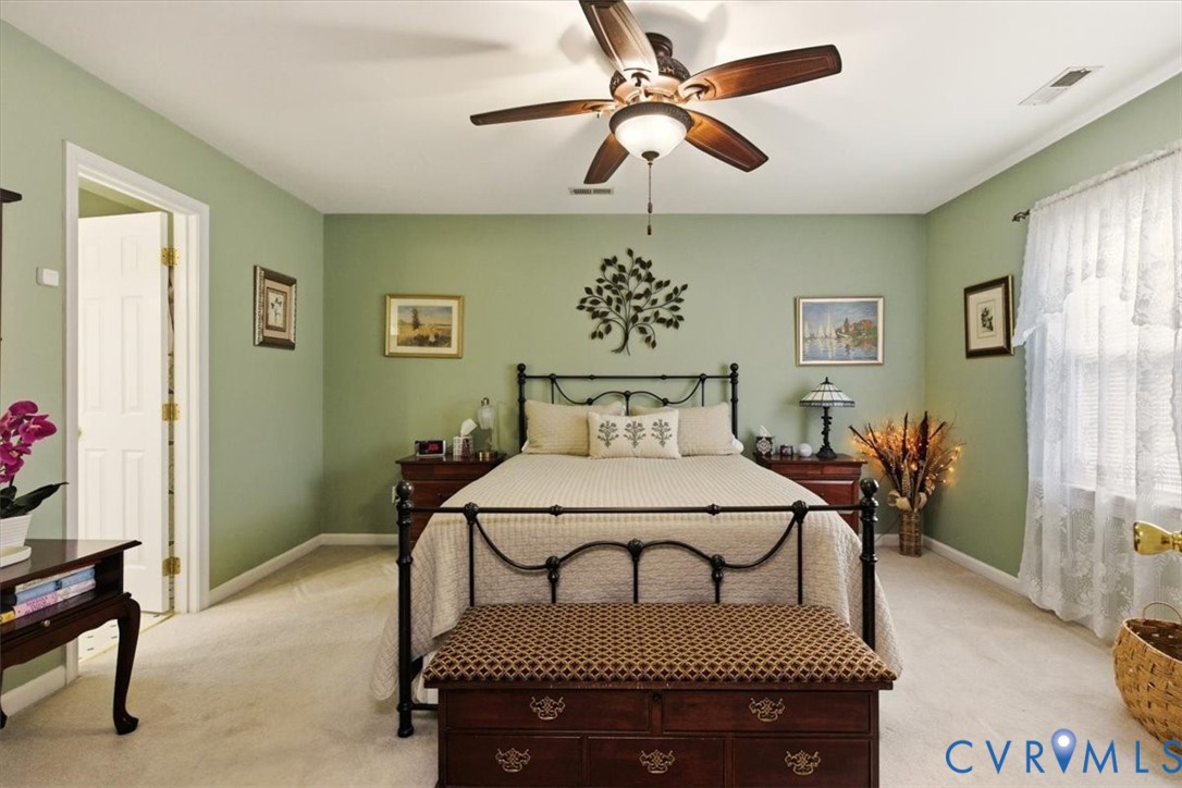 2604 Brookforest Terrace Midlothian, VA 23112 - Photo 25 of 49 a bedroom with a bed and a chandelier
