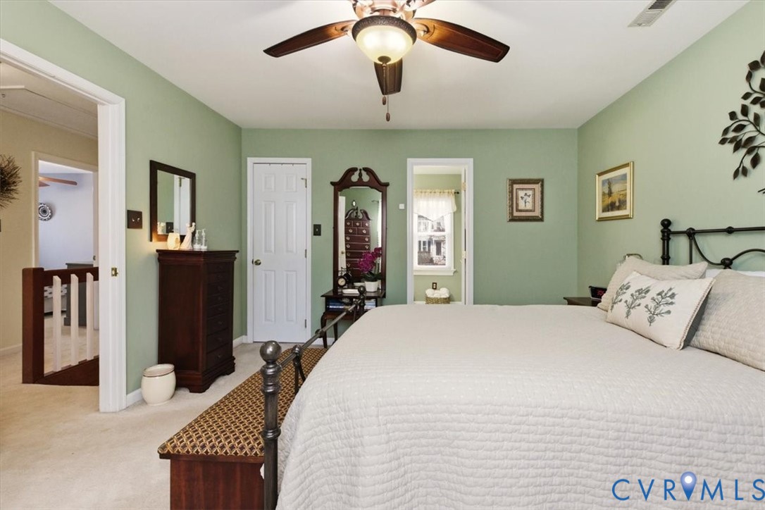 2604 Brookforest Terrace Midlothian, VA 23112 - Photo 26 of 49 a bedroom with a bed and a chandelier