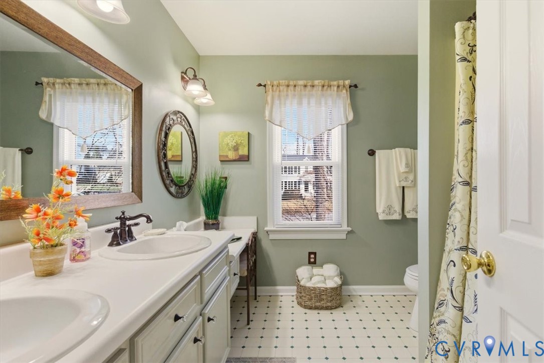 2604 Brookforest Terrace Midlothian, VA 23112 - Photo 28 of 49 a bathroom with a sink vanity and a mirror
