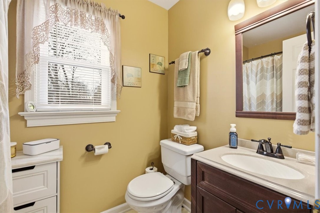 2604 Brookforest Terrace Midlothian, VA 23112 - Photo 30 of 49 a bathroom with a sink a toilet and a mirror