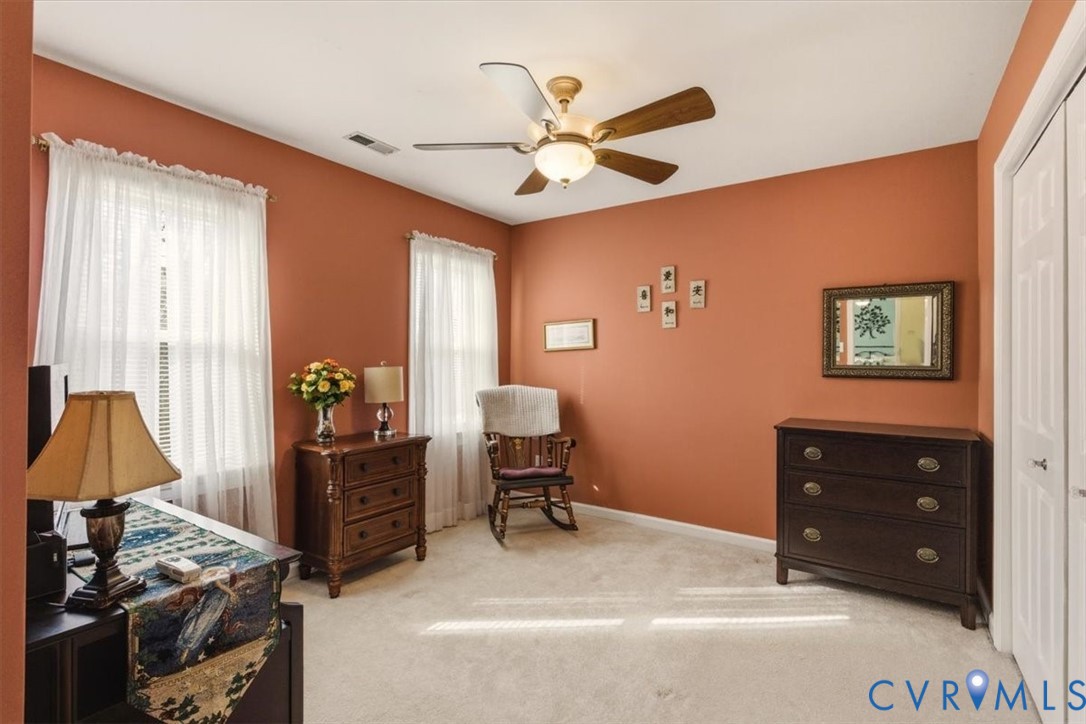 2604 Brookforest Terrace Midlothian, VA 23112 - Photo 31 of 49 a bedroom with a bed and a chandelier