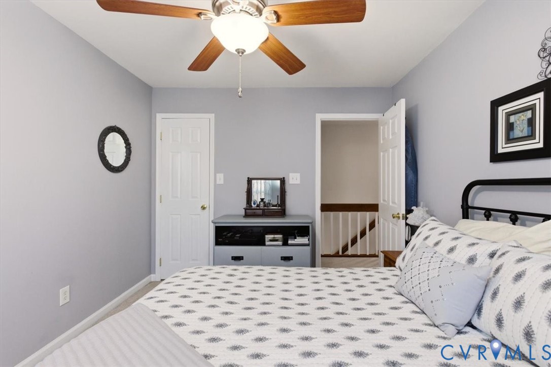 2604 Brookforest Terrace Midlothian, VA 23112 - Photo 35 of 49 a bedroom with a bed and a chandelier