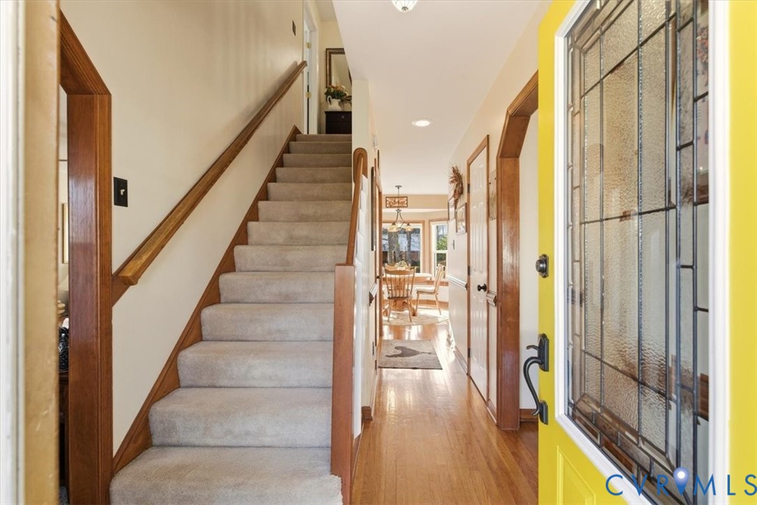2604 Brookforest Terrace Midlothian, VA 23112 - Photo 5 of 49 a view of a hallway with wooden floor and staircase