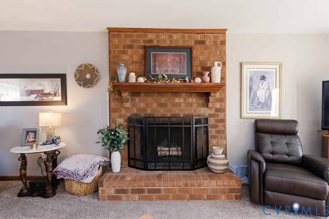 2604 Brookforest Terrace Midlothian, VA 23112 - Photo 8 of 49 a living room with furniture and a fireplace