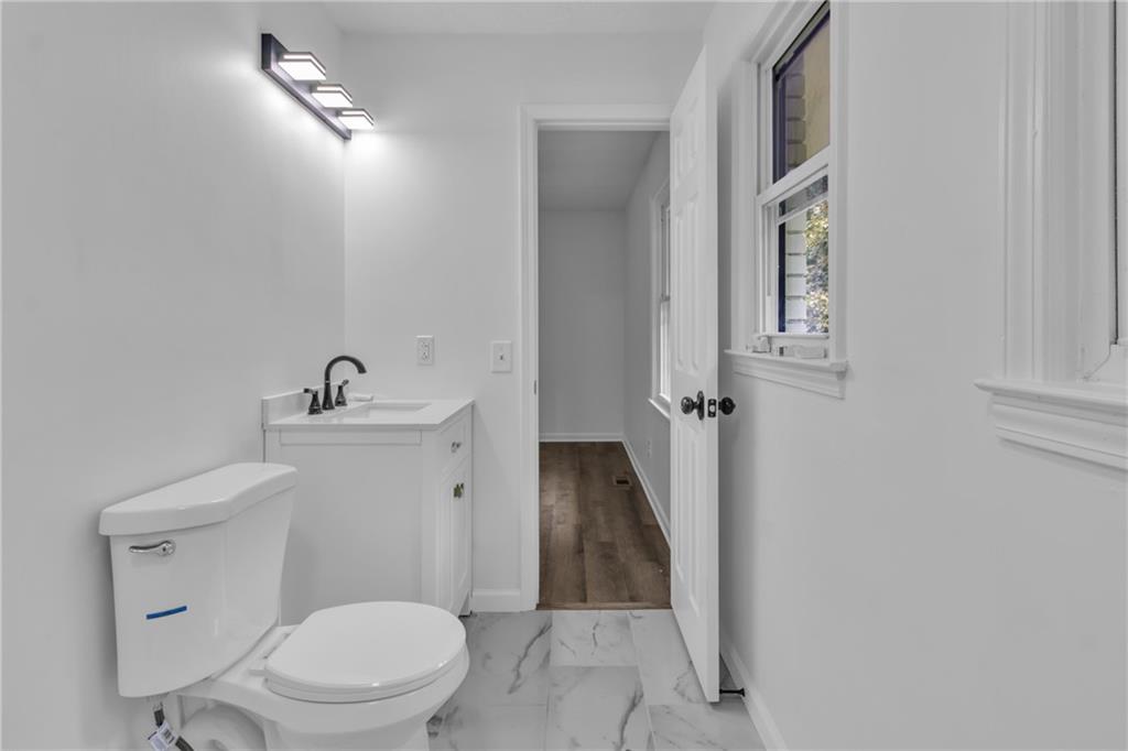 199 McKaskey Creek Road Southeast Cartersville, GA 30121 - Photo 21 of 34 a white toilet sitting next to a shower