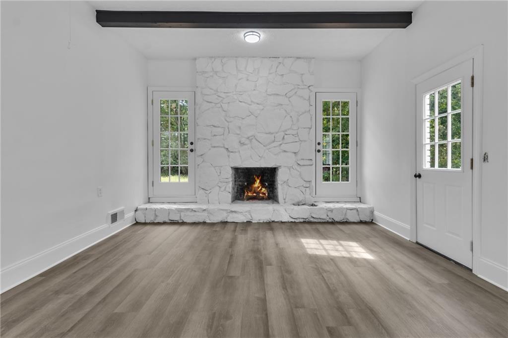 199 McKaskey Creek Road Southeast Cartersville, GA 30121 - Photo 25 of 34 a view of an empty room with wooden floor and a window