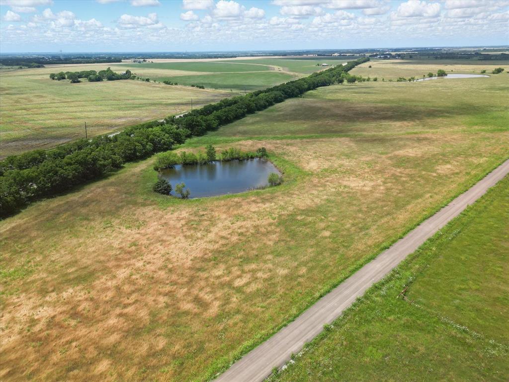 6482 County Road 1050 Celeste, TX 75423 - Photo 2 of 19 a view of an ocean and a yard