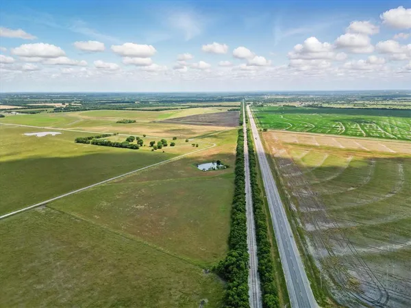 a view of a lake with a big yard