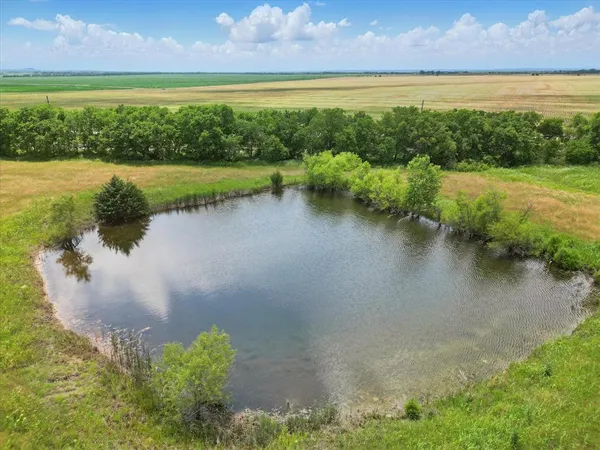 a view of a lake with a yard