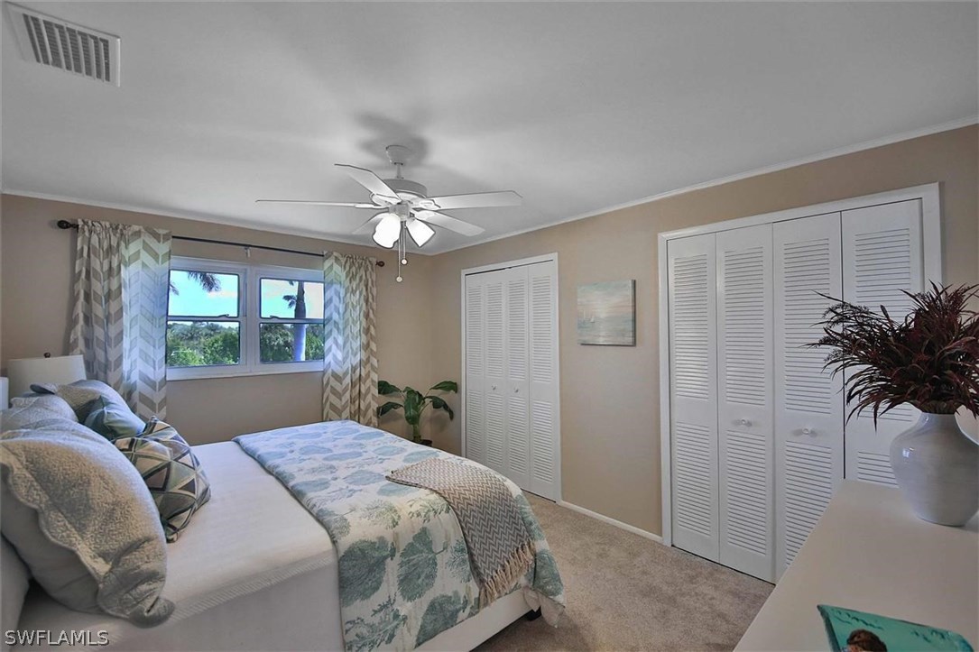 6777 Winkler Road, Unit 203 Fort Myers, FL 33919 - Photo 12 of 25 a bedroom with a bed and a window