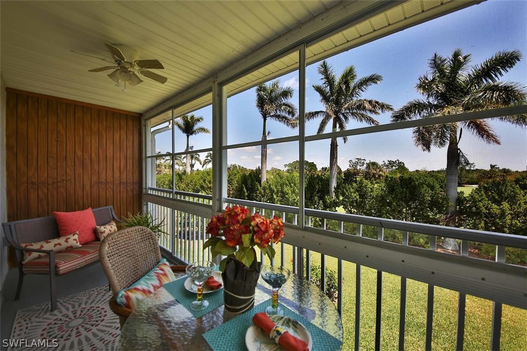 6777 Winkler Road, Unit 203 Fort Myers, FL 33919 - Photo 20 of 25 a balcony with furniture and a potted plant