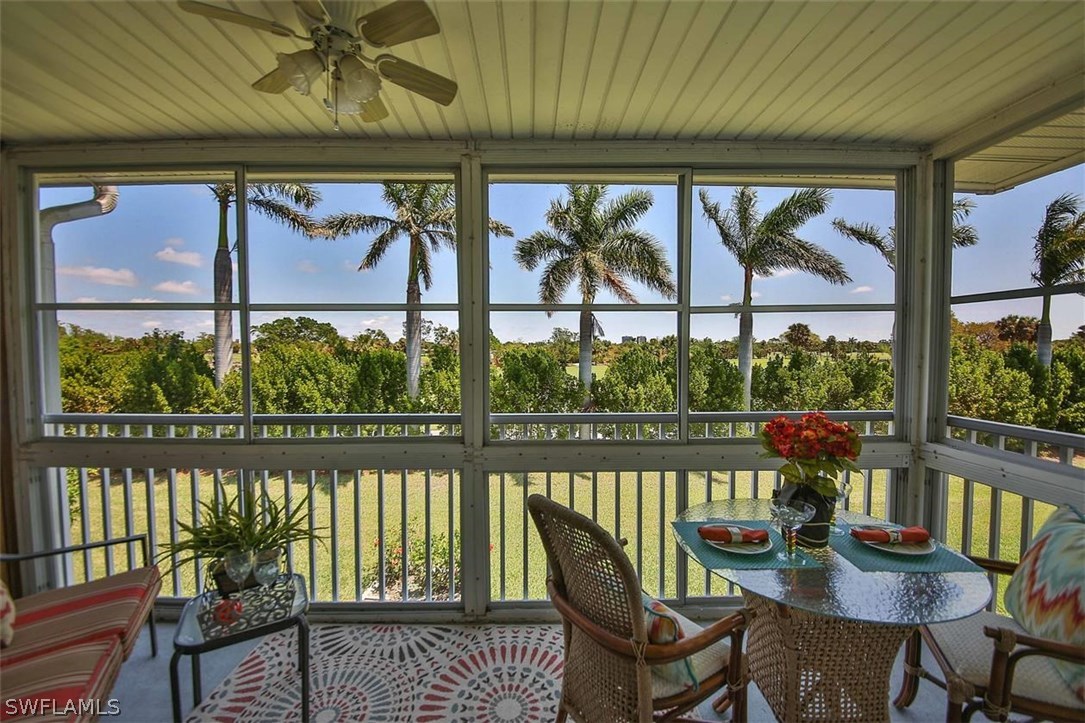 6777 Winkler Road, Unit 203 Fort Myers, FL 33919 - Photo 21 of 25 a view of a chairs and table in a balcony