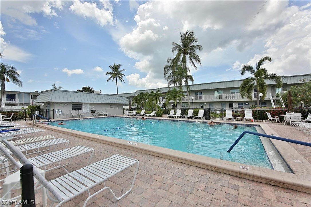 6777 Winkler Road, Unit 203 Fort Myers, FL 33919 - Photo 23 of 25 a front view of a house with garden