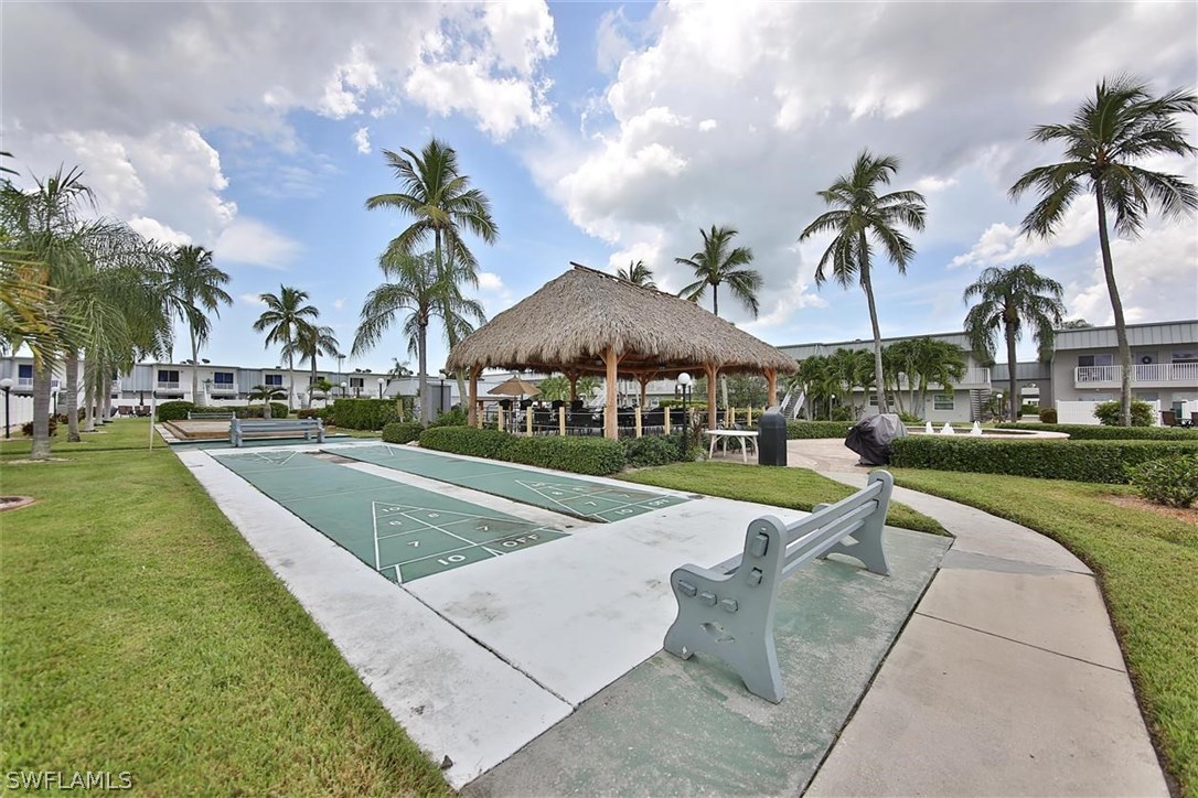 6777 Winkler Road, Unit 203 Fort Myers, FL 33919 - Photo 25 of 25 a view of a swimming pool and lounge chairs