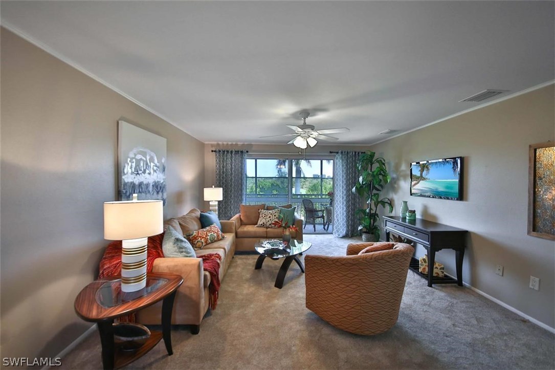 6777 Winkler Road, Unit 203 Fort Myers, FL 33919 - Photo 3 of 25 a living room with furniture and a potted plant