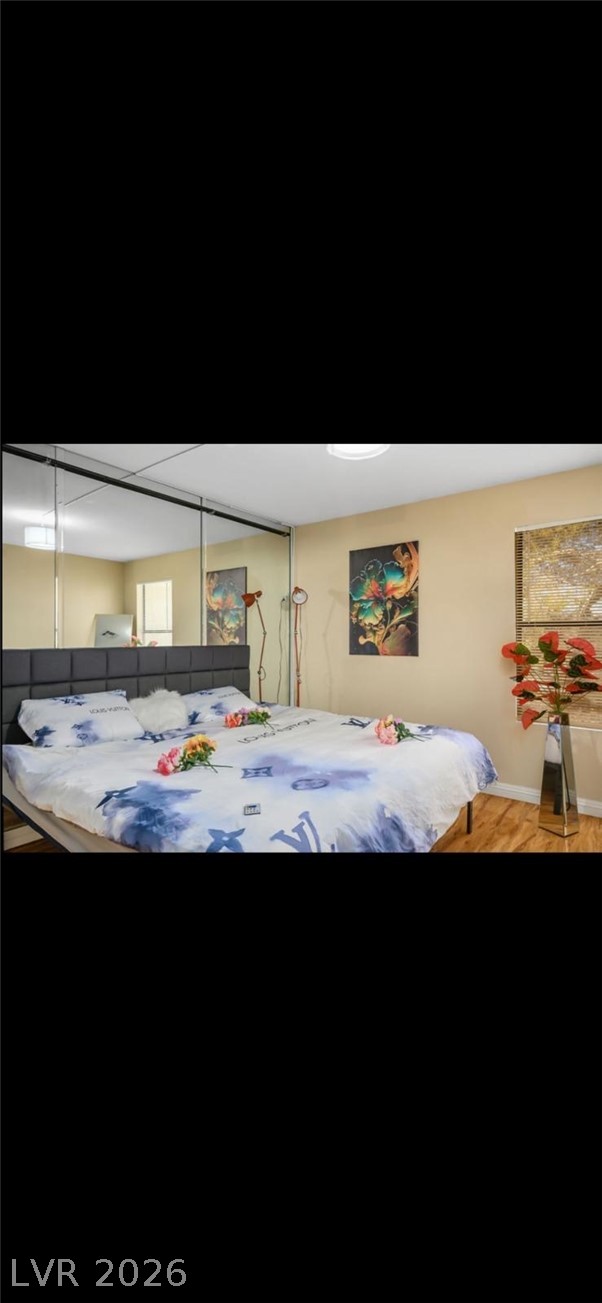 5131 South Lindell Road, Unit 205 Las Vegas, NV 89118 - Photo 17 of 22 Bedroom featuring wood finished floors