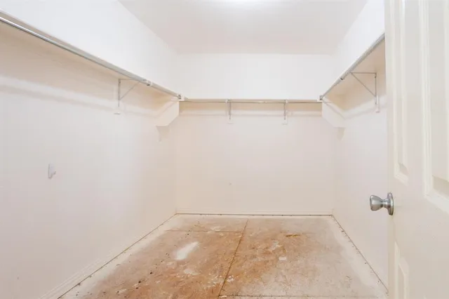 a view of an empty walk in closet
