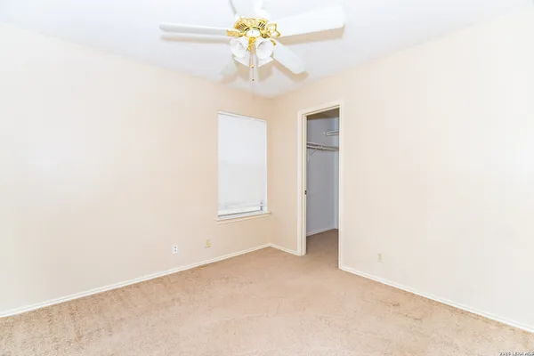 a view of a chandelier fan in a room