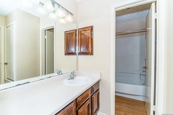 a bathroom with a sink and a mirror