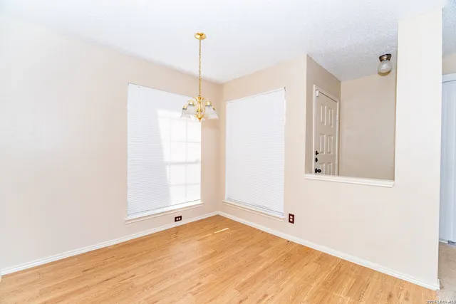 a view of an empty room and window