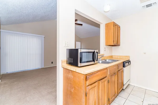 a kitchen with a stove and a microwave