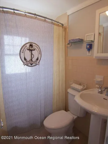a bathroom with a toilet and a sink