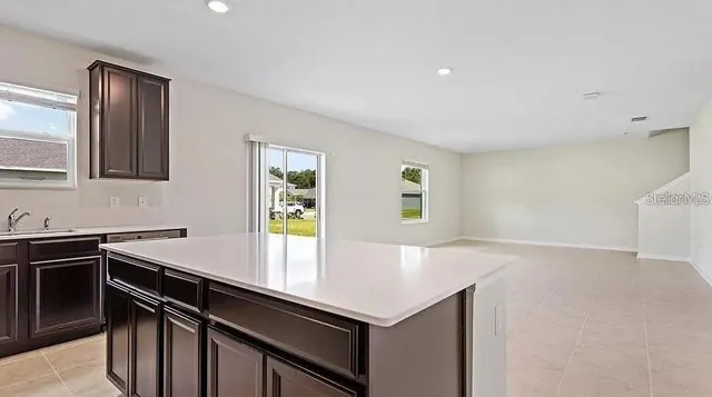 a kitchen with a sink and cabinets