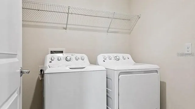 a utility room with dryer and washer