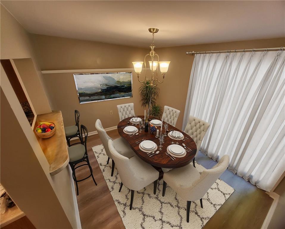 279 Nelson Run Road Pittsburgh, PA 15237 - Photo 12 of 38 a view of a dining room with furniture and wooden floor