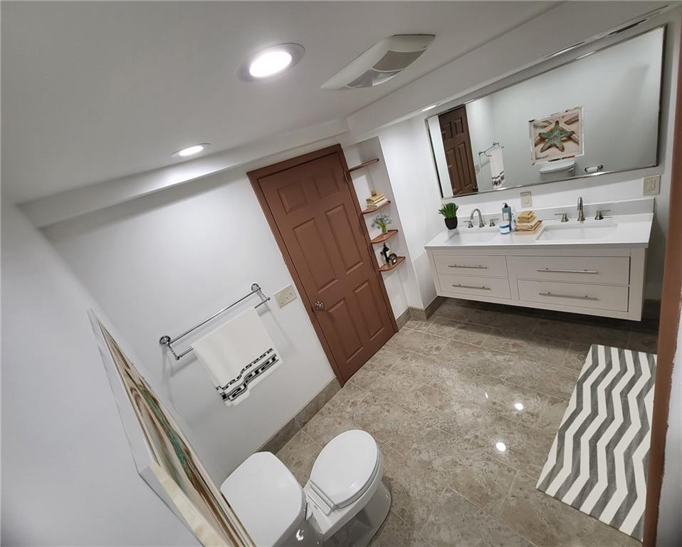 279 Nelson Run Road Pittsburgh, PA 15237 - Photo 15 of 38 a bathroom with a sink mirror and toilet