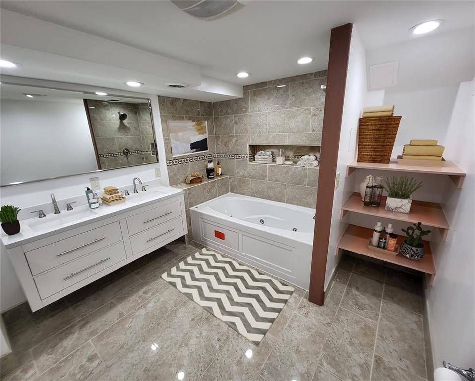 279 Nelson Run Road Pittsburgh, PA 15237 - Photo 17 of 38 a bathroom with a double vanity sink a mirror and bathtub