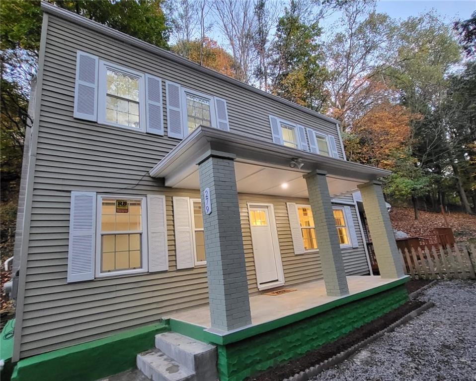 279 Nelson Run Road Pittsburgh, PA 15237 - Photo 2 of 38 a front view of a house with a yard