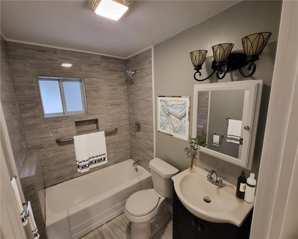 279 Nelson Run Road Pittsburgh, PA 15237 - Photo 25 of 38 a bathroom with a toilet sink vanity and mirror