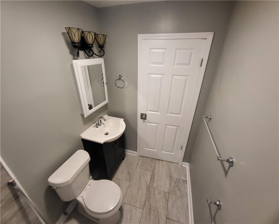 279 Nelson Run Road Pittsburgh, PA 15237 - Photo 29 of 38 a bathroom with a toilet sink and mirror