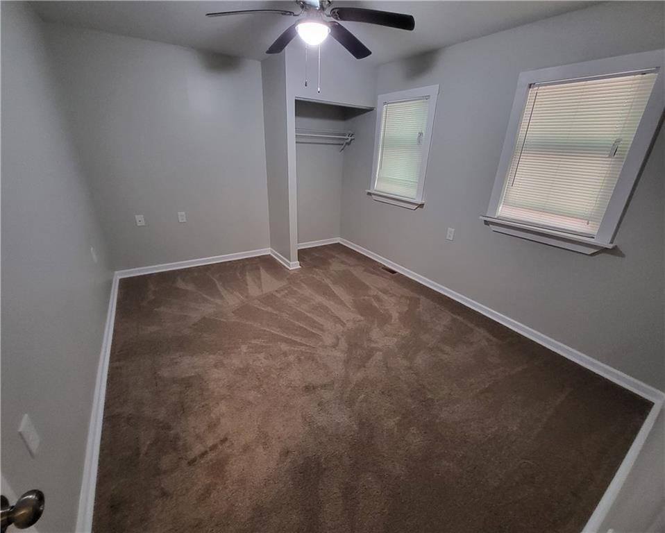 279 Nelson Run Road Pittsburgh, PA 15237 - Photo 30 of 38 an empty room with a chandelier fan and windows