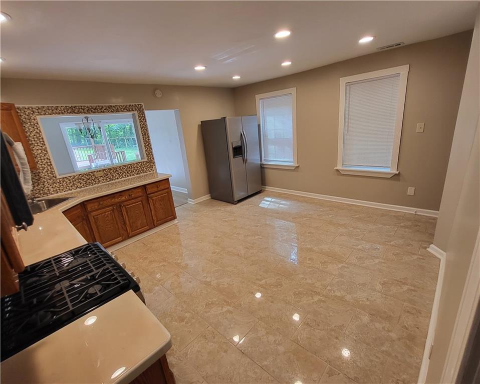 279 Nelson Run Road Pittsburgh, PA 15237 - Photo 10 of 38 a kitchen with stainless steel appliances granite countertop a refrigerator and a stove