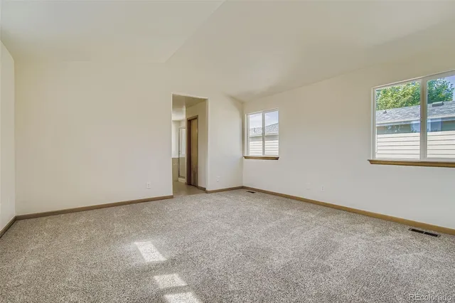 an empty room with windows