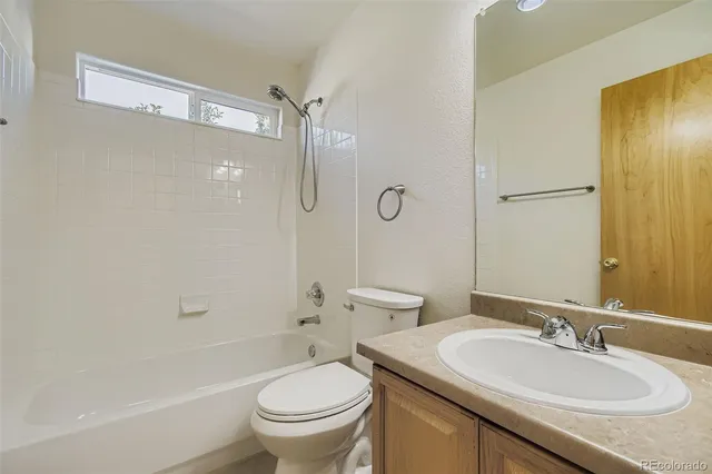 a bathroom with a sink toilet tub and shower