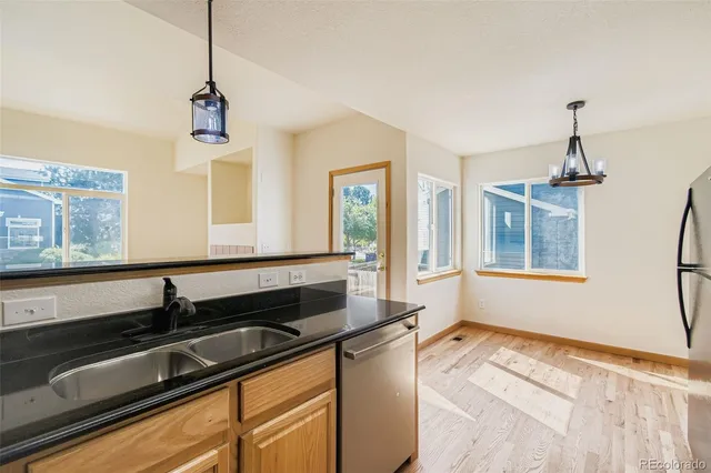 a kitchen that has a sink and a stove