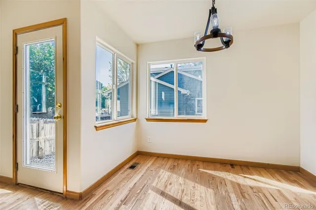 a view of an empty room with a window