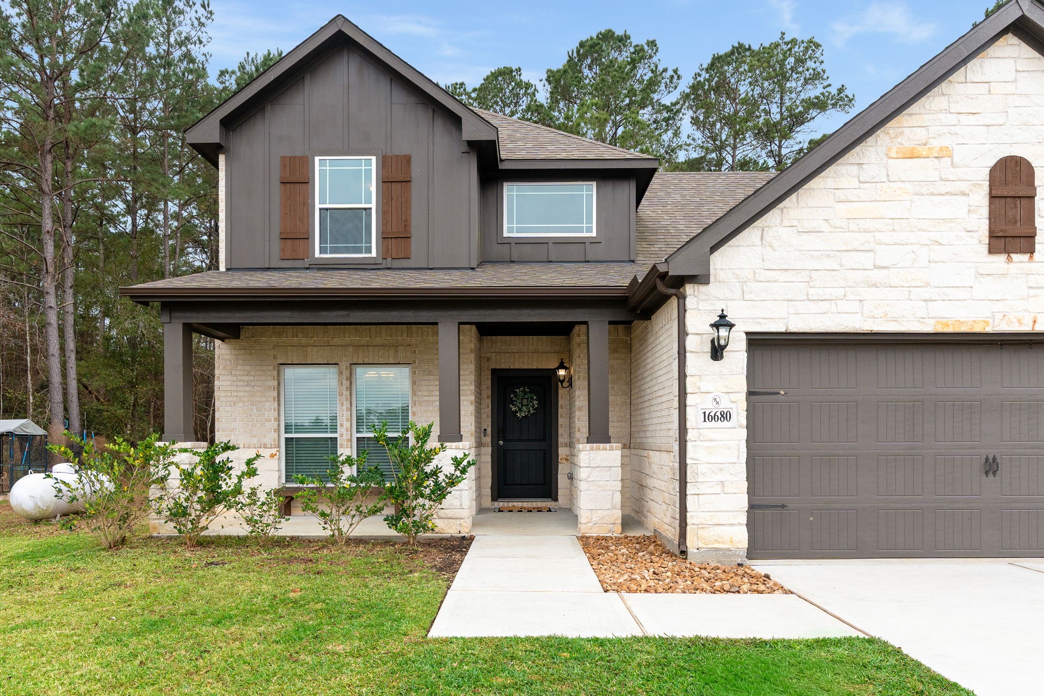 16680 Rockwall Street Conroe, TX 77303 - Photo 2 of 38 Upgrades also include front gutter and front sprinkler system.