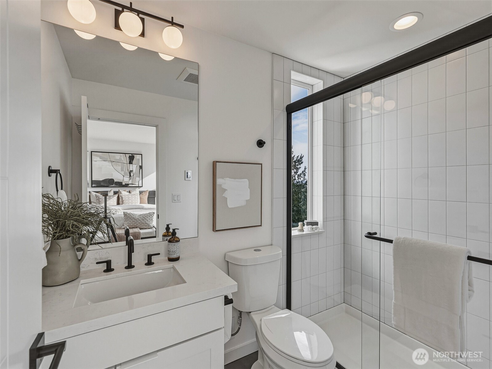6320 41st Avenue Southwest, Unit A Seattle, WA 98136 - Photo 24 of 39 a bathroom with a sink vanity mirror and toilet