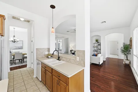 a spacious bathroom with a sink a large mirror and a shower